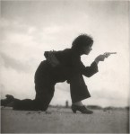 Woman soldier shooting pistol during Spanish Civil War
