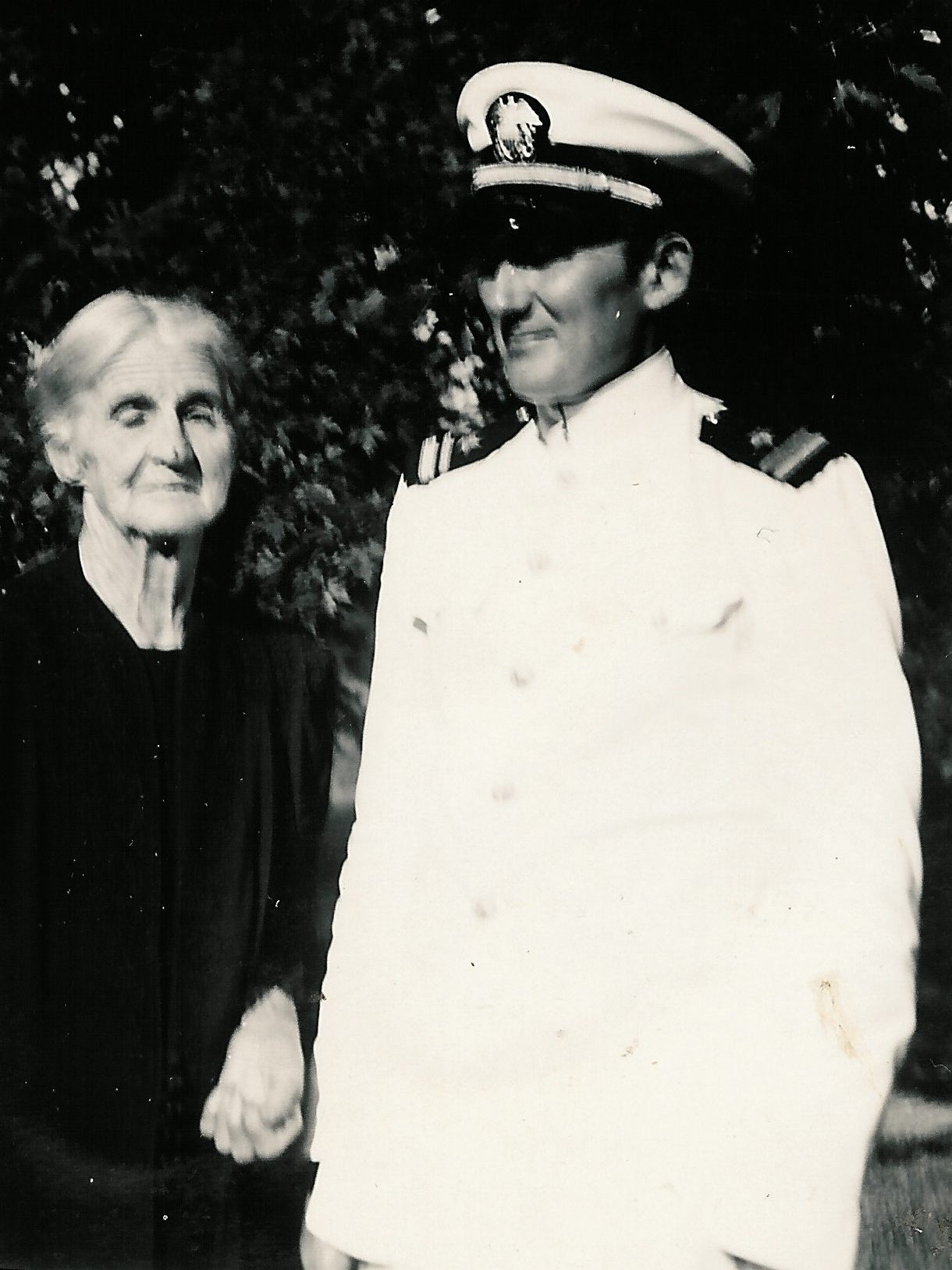 Grandmother Louvisa and Gene in his white Navy uniform, circa 1942